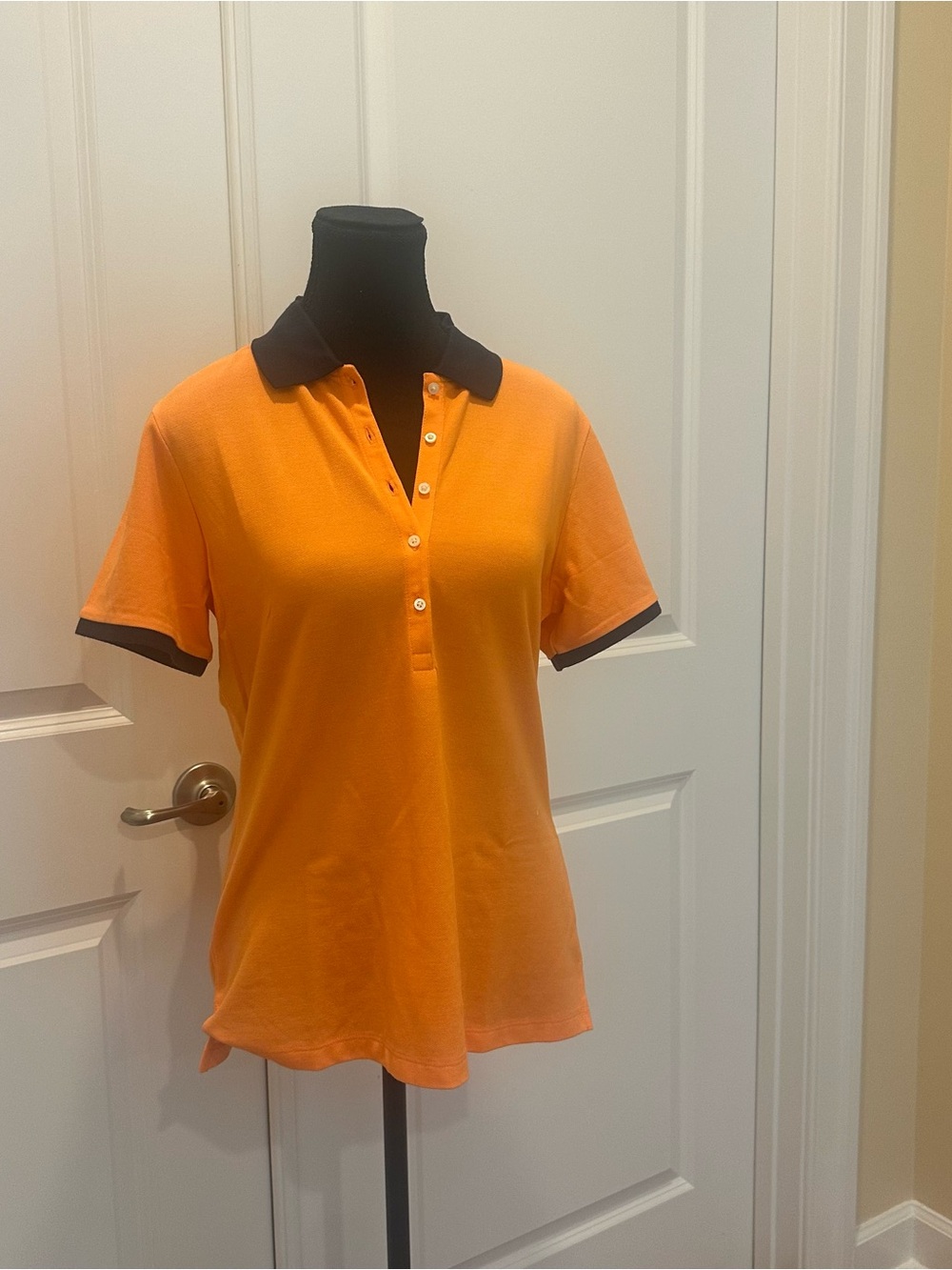 Lady Hagen Orange Button-Down Polo with Black Collar